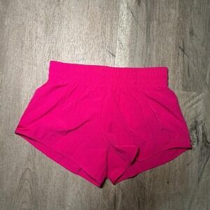 Hot pink athletic shorts with built in liner
